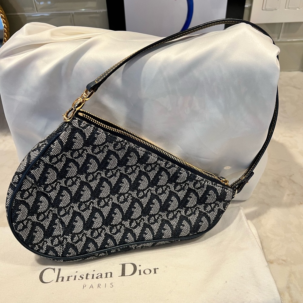Christian Dior Monogram mini Saddle Pochette.